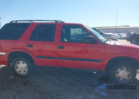 1999 GMC Jimmy Sle z USA, uszkodzony, nr VIN 1GKCS13WXX2554579